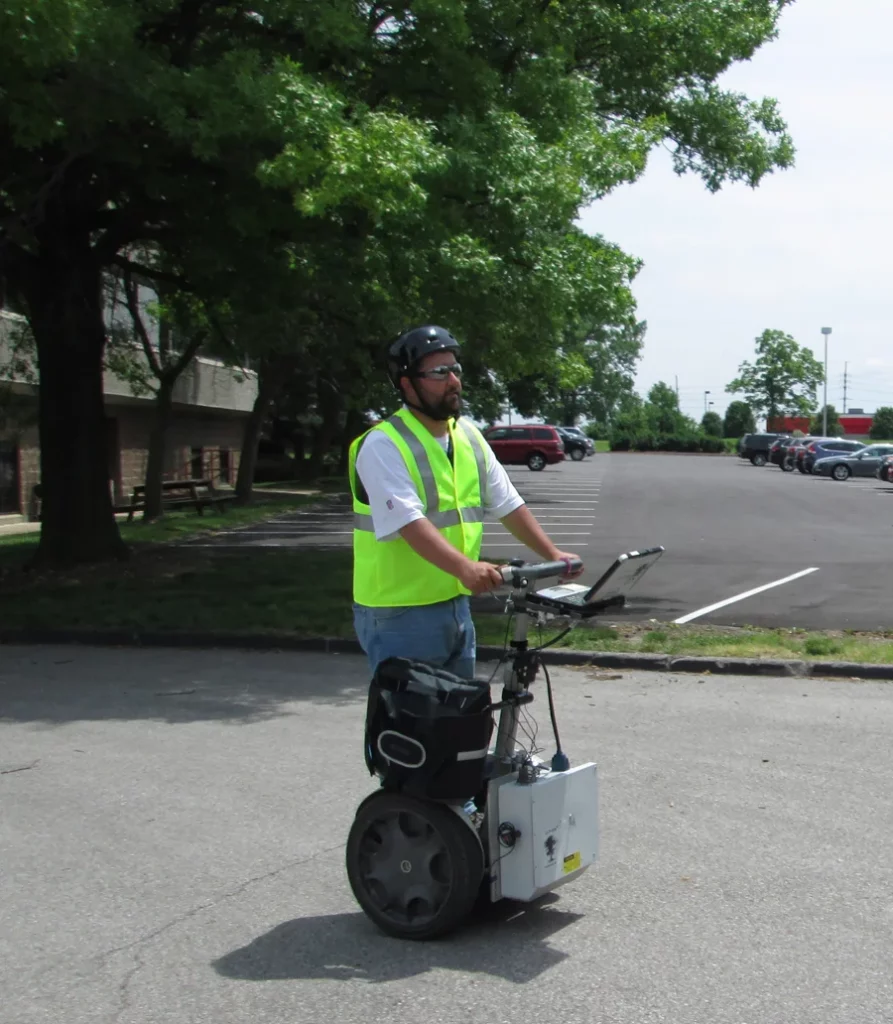 Colleague working on a ADA Transition Planning project on scooter